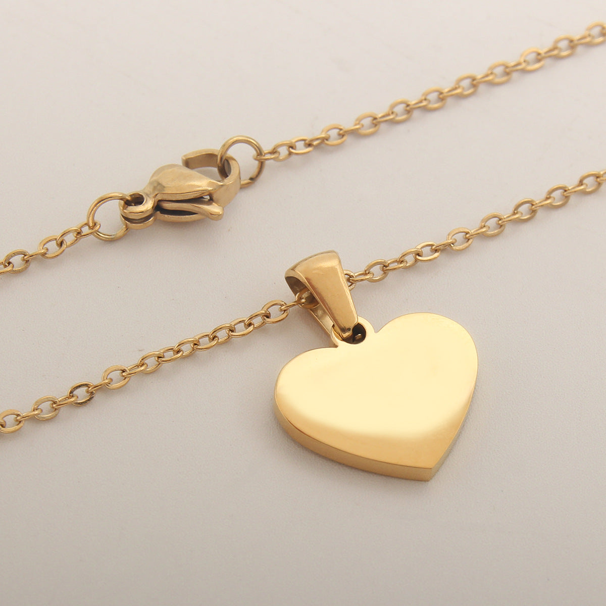 Heart-shaped letter Necklaces.