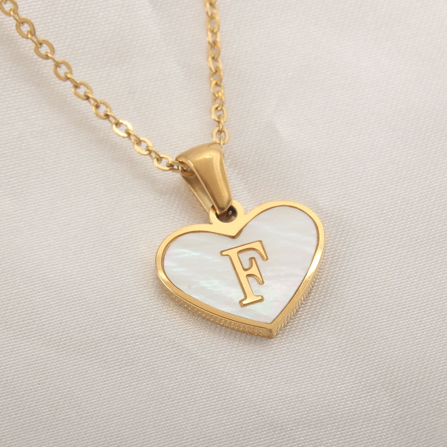 Heart-shaped letter Necklaces.